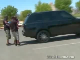 Blonde milf sucks on a ebony boner immediately after being picked up in a caressing lot